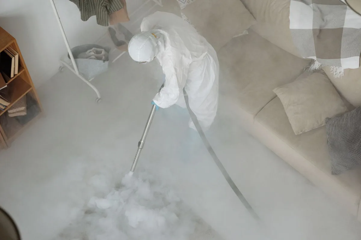 Biohazard cleanup technician in protective equipment, Unionville, GA